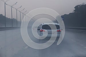 car traffic on highway in rain