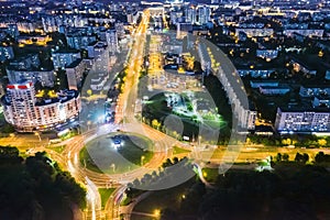 Car traffic in night city. aerial view of highway intersection. long exposure