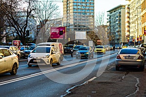 Car traffic at rush hour in downtown area of the city. Car pollution, traffic jam in the morning and evening in the capital city