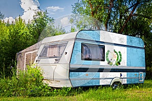 A car trailer, a motor home, painted in the national flag