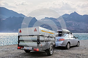 Car trailer by the sea