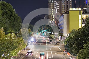 Car trails on the busy street in dowtown city center Portland, Oregon skyline