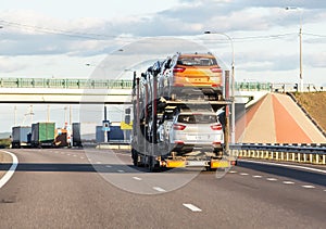 Car transporter carries cars along the highway