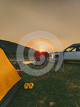 car travel concept camping place near mountains river