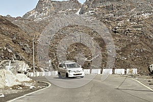 Car traveling downhill on curved mountain roads. Vehicle driving driving in a hairpin bend shoot from car. Rural Roadside. Road