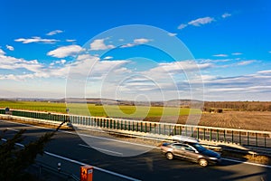 Car traveling on the highway at sunse