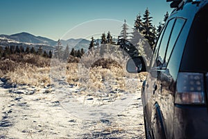 car for traveling with a winter mountain road