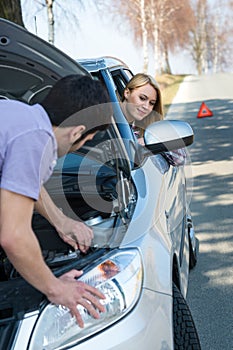 Car troubles couple starting broken vehicle