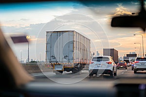 Car and trucks in Traffic jam on highway in rush hour.