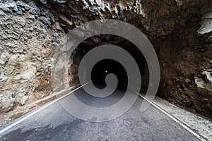 Car tunnel in the rock.