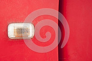Car turn signal lights - doors - old classic red cars being repaired and recycled