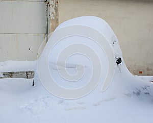 Car turned into a snowdrift covered with snow