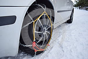 Car with tyre chains in winter