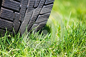 Car tyre on the green grass