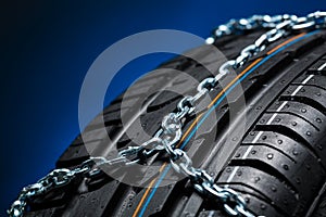 Car tyre with snow chain for winter