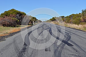 Car tyre tire skid marks on urban asphalt road