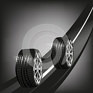 Car tyres on the road isolated on black background