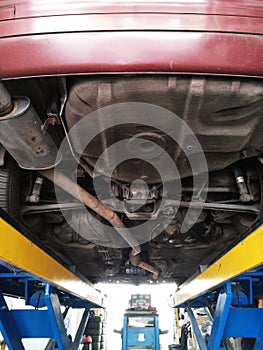 Car under carriage for auto garage workshop services foreman mechanic