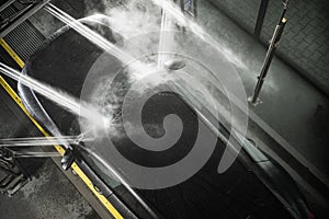 Car Under High Pressure Washing System Inside Touchless Car Wash