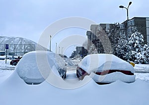 Car under the snow. Heavy snow.