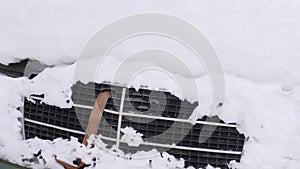 Car in under the snow. A large amount of snow almost completely fell asleep car