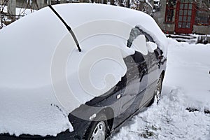 Car under the snow., winter weather vehicle.