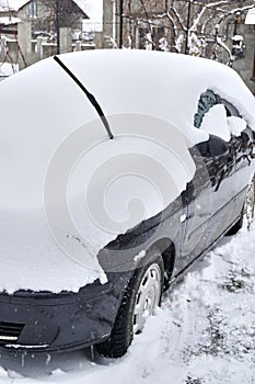 Car under the snow., winter weather vehicle.