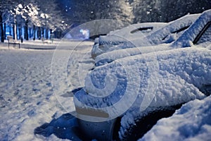 Car under the snow., winter weather vehicle. Cars blocked by snow on roads, street snow-paralysis of traffic.