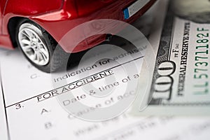 Car and US dollar banknotes on Insurance claim accident car form background, Car loan, Finance, saving money, insurance and