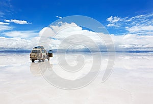 Car on the Uyuni Salar in Bolivia photo