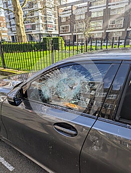 Car vandalism smashing windows photo