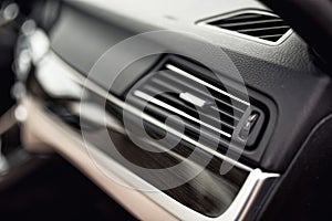 Car ventilation system with adjustment buttons and details of modern car