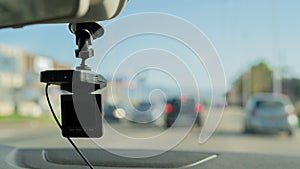 Car video camera dash cam inside of car on highway with blurred background of highway road, from perspective of the driver. Conc