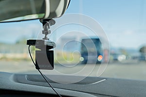 Car video camera dash cam inside of car on highway with blurred background of highway road, from perspective of the driver. Conc