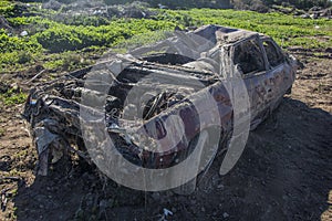 A car that was destroyed in a pole after the hurricane, shattered car