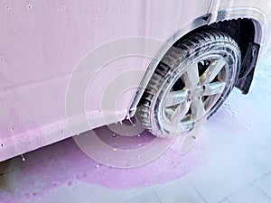 Car wash for cleaning dirty cars and caring for the body of an SUV.