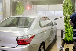 Car wash. Cleaning high-pressure water cars and foam in the washing station