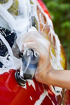 Car wash with flowing water and foam