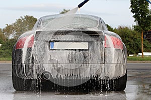 Car wash with foam at self-service car wash station