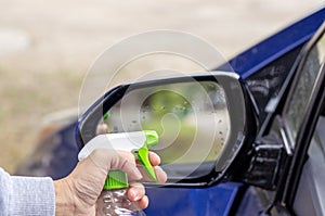 car wash and interior chemical cleaning concept.woman hand use microfiber cloth and spray to clean