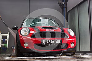 car wash red mini cooper.