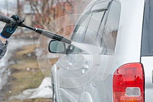 Car wash. Wash the car with high water pressure. High water pressure on the car.