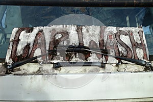 Car Wash words on dirty car window
