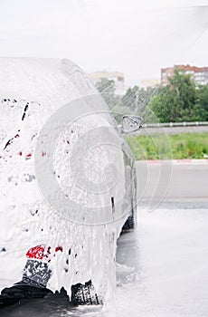 car washed through a gun with detergent at the sink