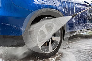 Car Washing. Cleaning Car Using High Pressure Water. Autowashing outdoors