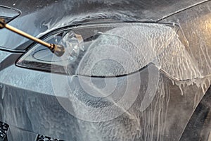 Car washing under high pressure water