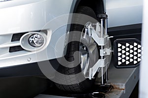 Car wheel adjusted with automobile alignment