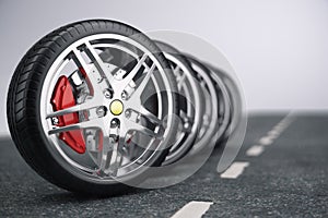 Car wheel, car tire standing on a road. Concept tyres. Car tire with a disc standing on the asphalt road. 3D