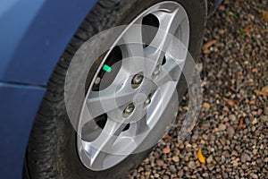 car wheel on the ground to illustrate safety check before driving and car maintenance concept