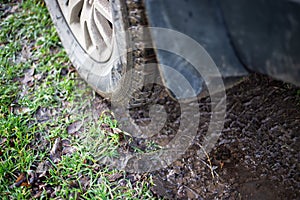 Car wheel on a muddy road in the countryside. High flotation tires